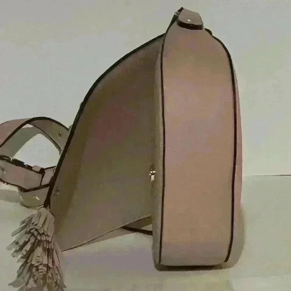A Victoria’s Secret light pink crossbody bag w/ tassels. - Picture 4 of 9